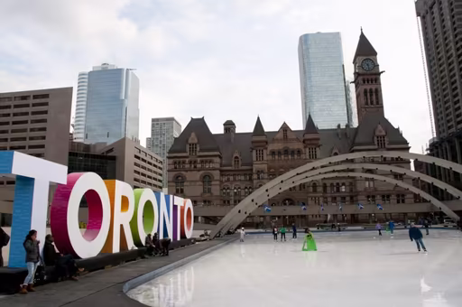 Ice skating rink next to Toronto sign